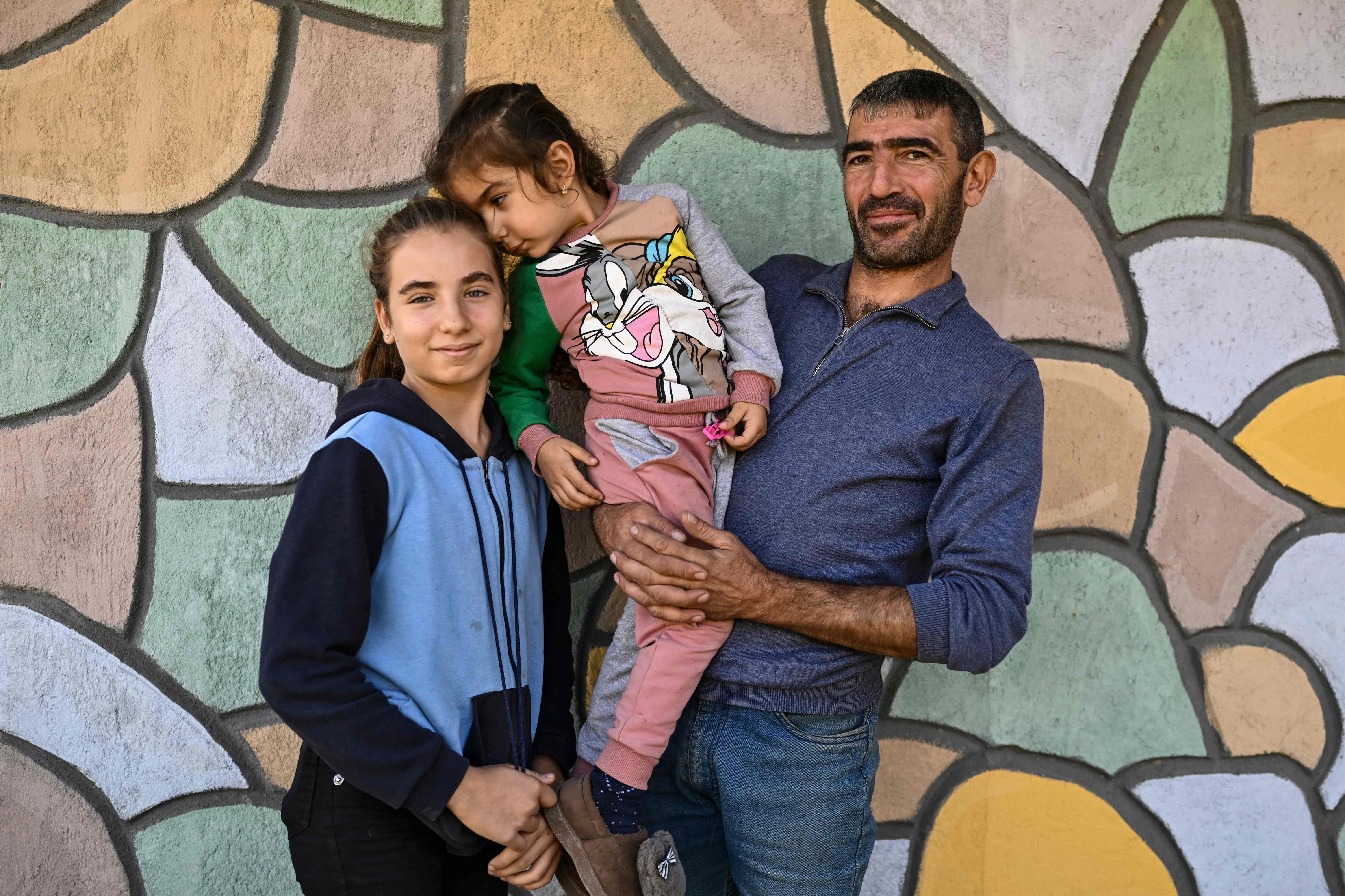 Ara Moussaelian, 39, with his two daughters, who also reside close to the border