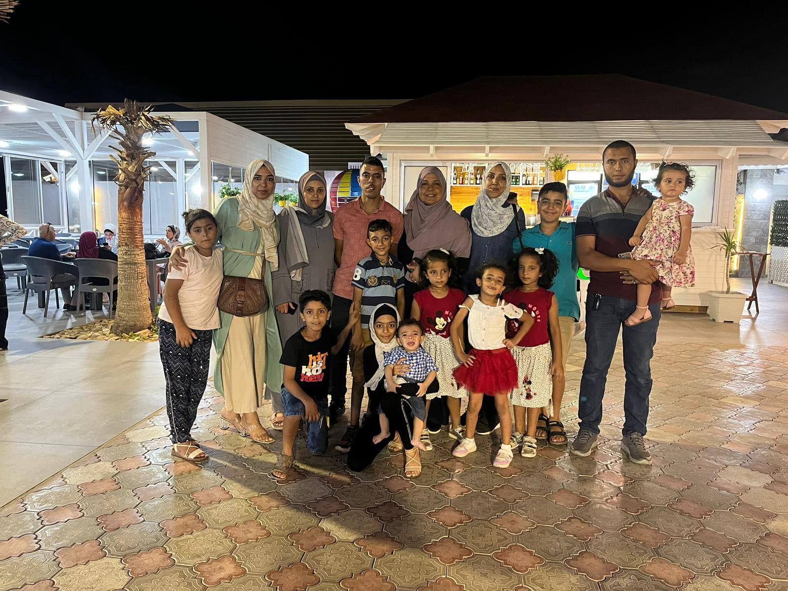 Waf’a spent the summer in Gaza in 2022. She is pictured here with her mother, sister, brothers, their wives and children