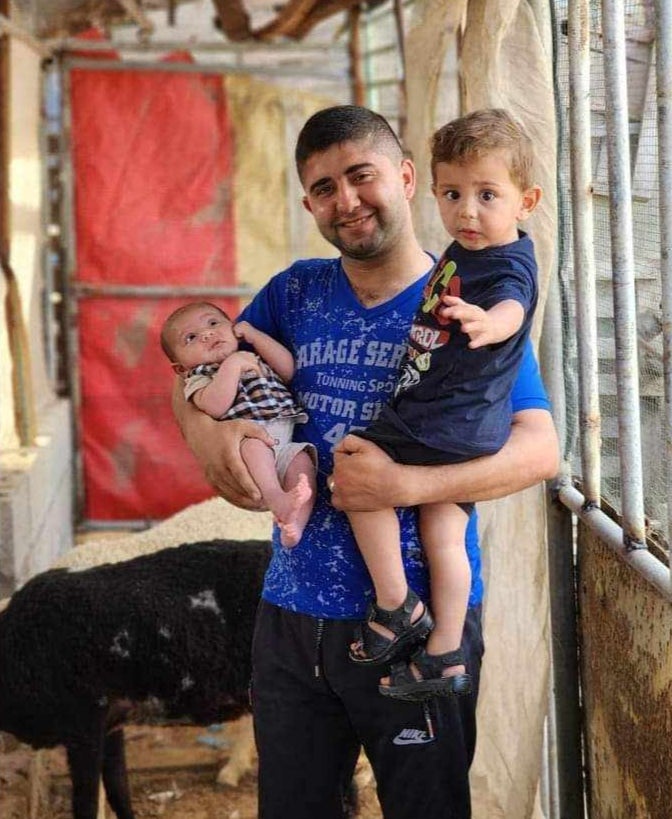 Two-month-old Omar and two-year-old Abdel Naser with their father, Ahmed Shamlakh. All three were killed in the air strike