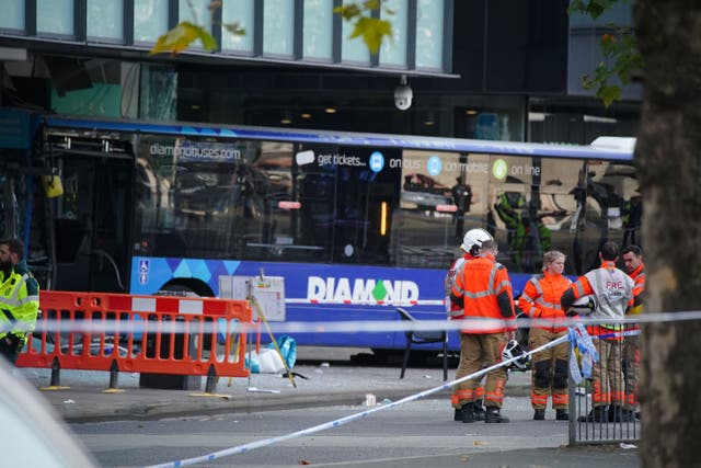 Emergency services at the scene of a bus crash close to Manchester’s Piccadilly Gardens Metrolink stop (Peter Byrne/PA)