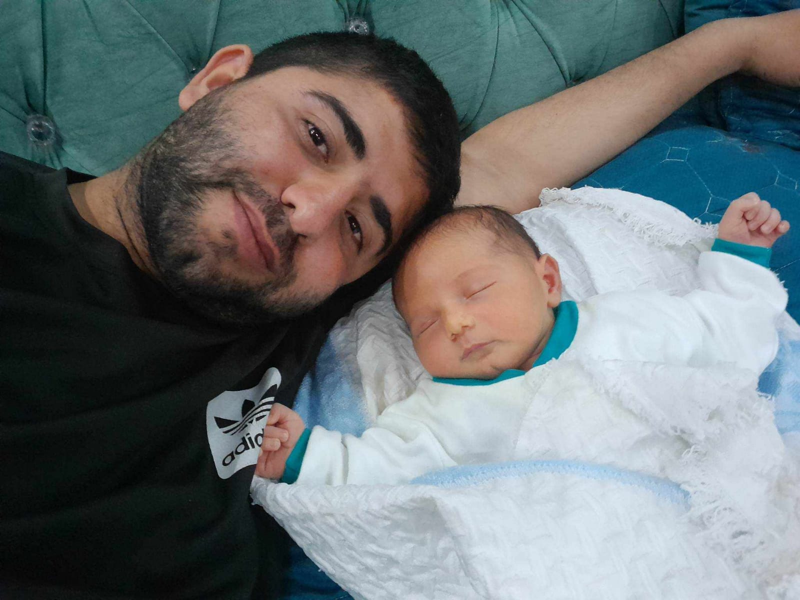 Omar as a newborn with his father, Ahmed