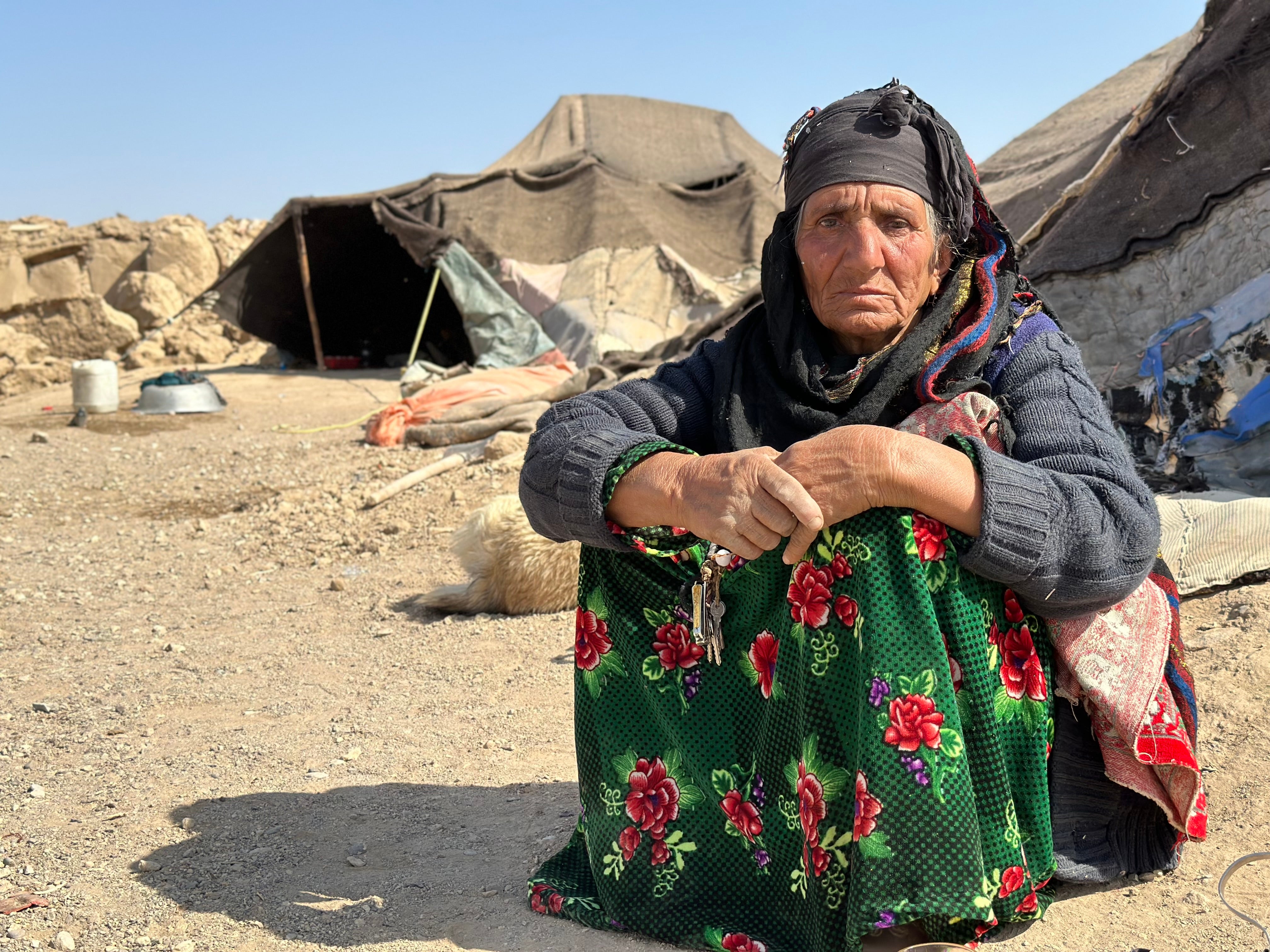 An Afghan woman who lost her home in Chahak village, Injil district, in Herat