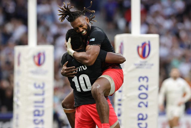 <p>Captain Waisea Nayacalevu embraces Vilimoni Botitu after the fly half’s try against England </p>