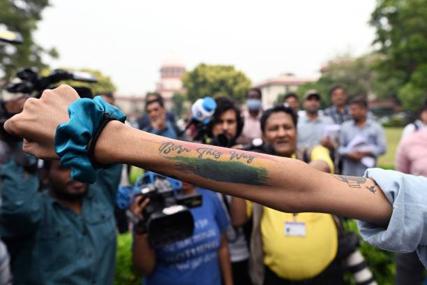 An activist displays a tattoo reading ‘Born this way’ in the courtyard of India’s Supreme Court in New Delhi on 17 October 2023