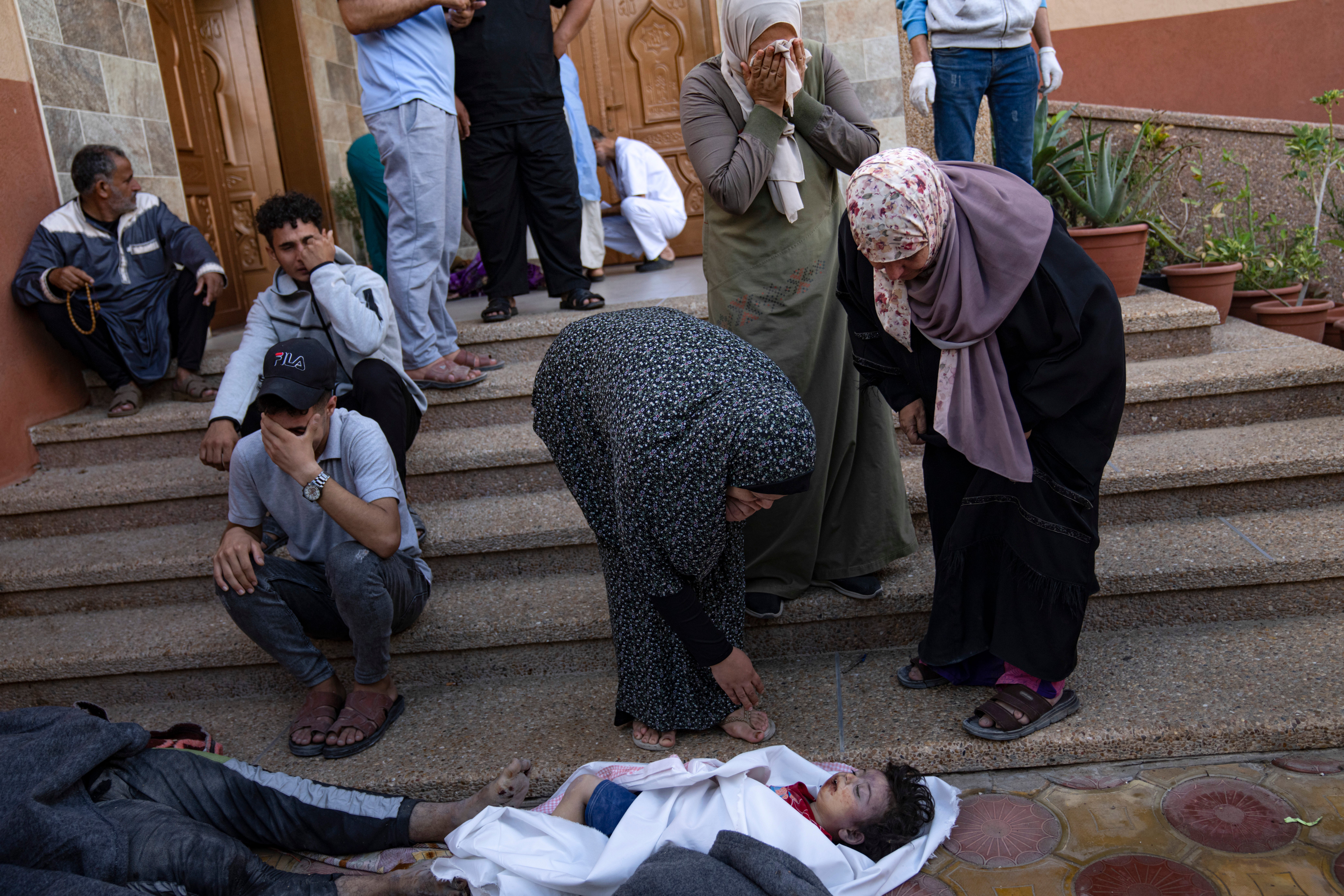 Palestinians mourn relatives killed in the Israeli bombardment of the Gaza Strip