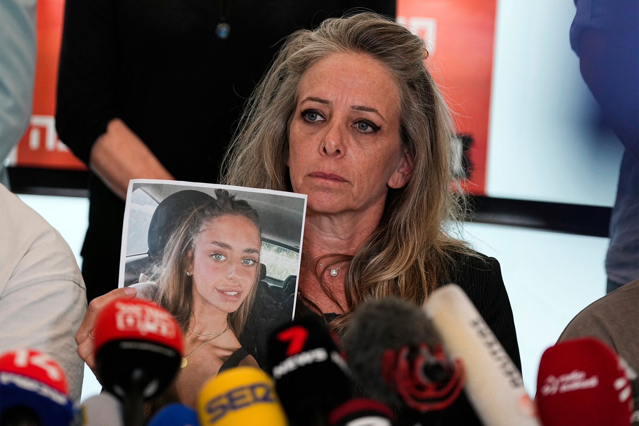 Keren Schem holds a photograph of her 21-year-old daughter, Mia Schem, who is currently being held hostage by Hamas