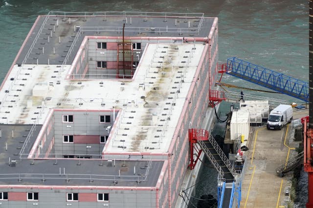 The barge at Portland Port in Dorset will house up to 500 people (PA)