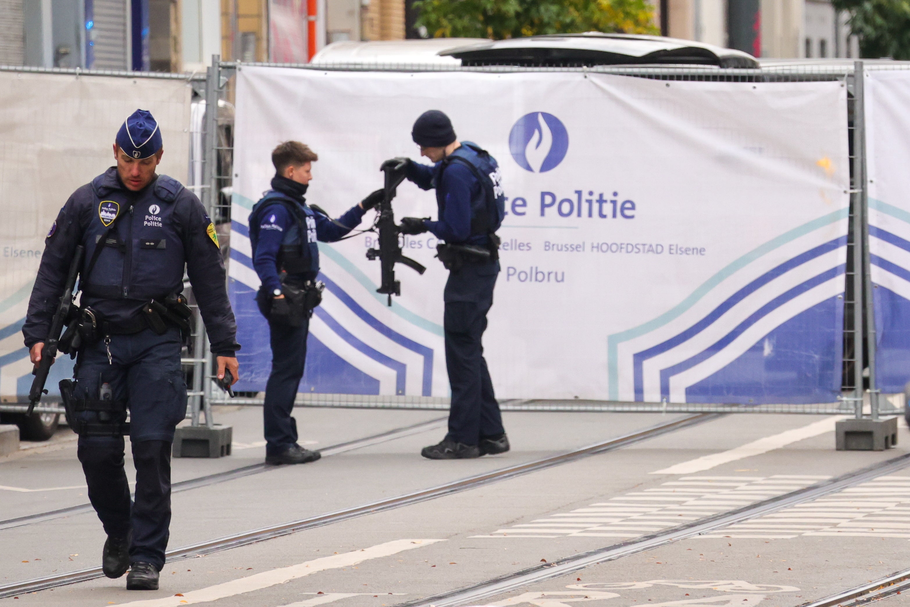 The suspect fled the scene after the shooting as a football match between Belgium and Sweden was about to start