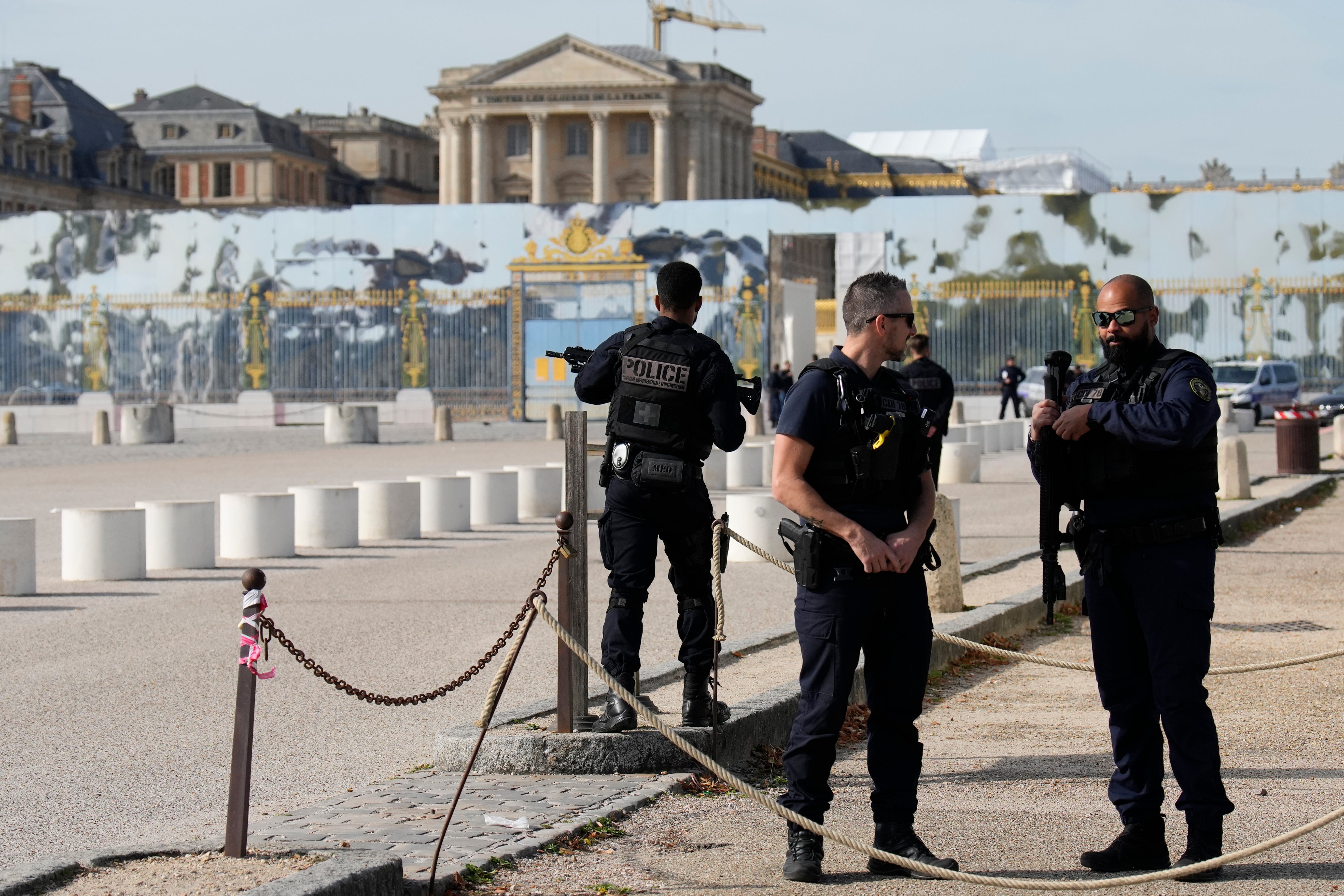 French police officers were guarding the entrance of the Chateau de Versailles after a security alert Tuesday