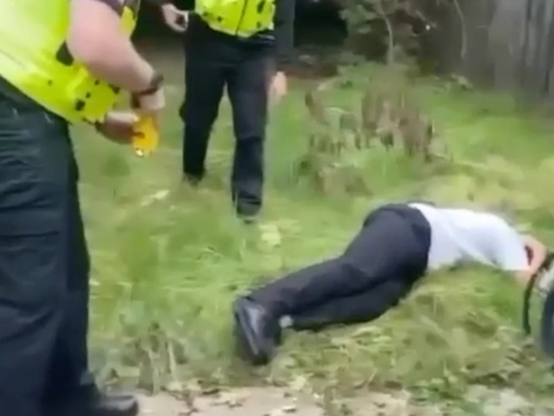 Video of the footage shows the boy cowering on the ground after being tasered