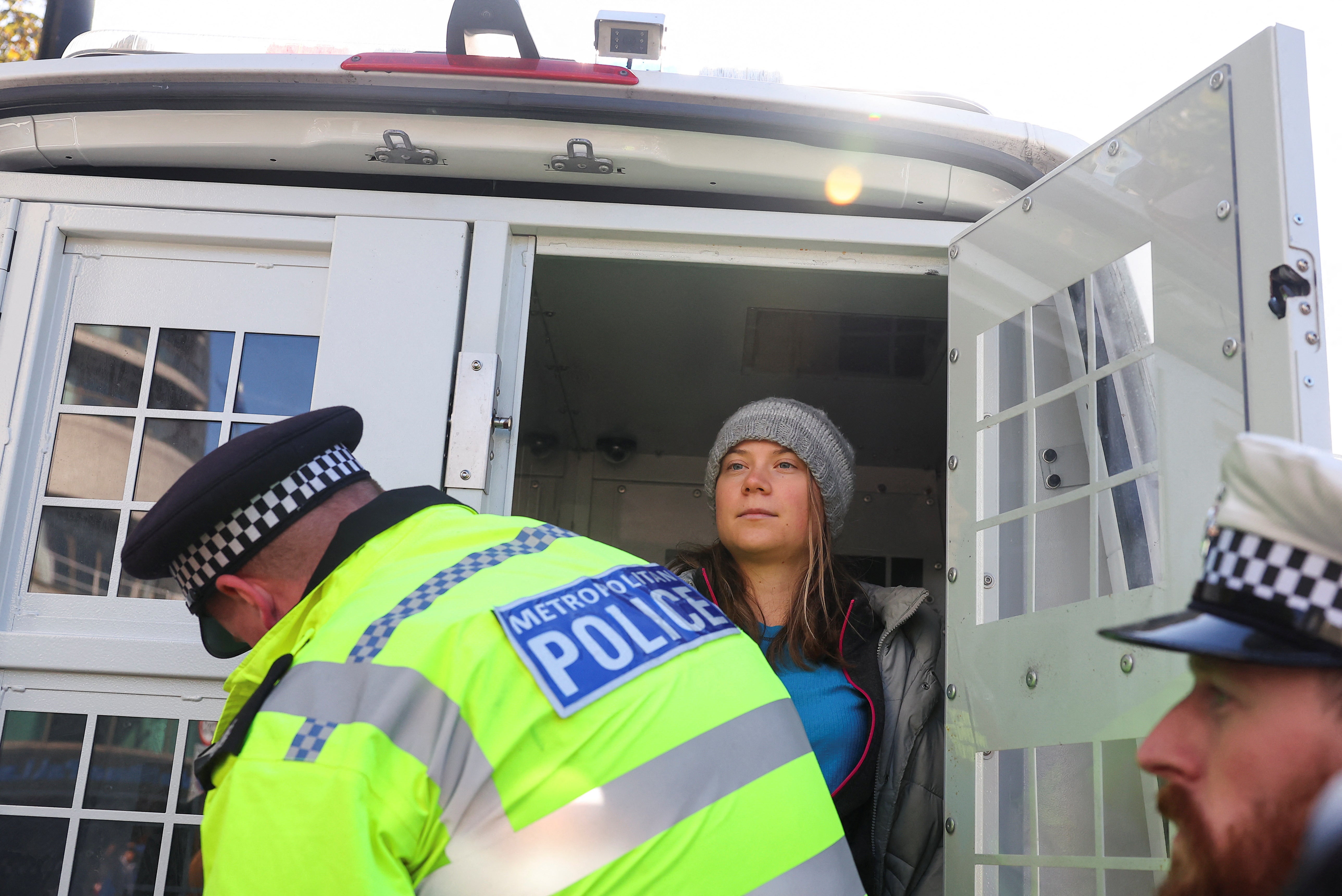 Swedish climate campaigner Greta Thunberg is put in the back of a police van, while being detained, during an Oily Money Out protest in London