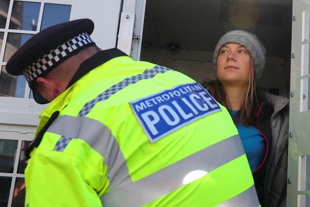 <p>The climate activist was pictured standing inside a police van in Mayfair </p>