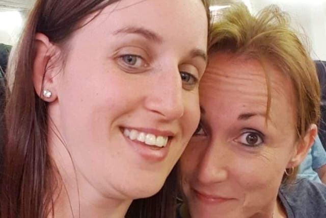 <p>The former police officer (left) and her partner who she abused </p>