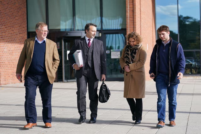 Hannah Ingram-Moore attended an appeal hearing against the demolition of a spa pool block at her home, with husband Colin (far left) and son Benji (right) (Joe Giddens/PA)