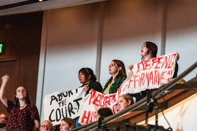 <p>Protesters interrupt the session as U.S. Supreme Court Justice Amy Coney Barrett speaks with Professor Robert A. Stein at Northrop Auditorium as part of the Stein Lecture Series in Minneapolis, Monday, Oct. 16, 2023.</p>