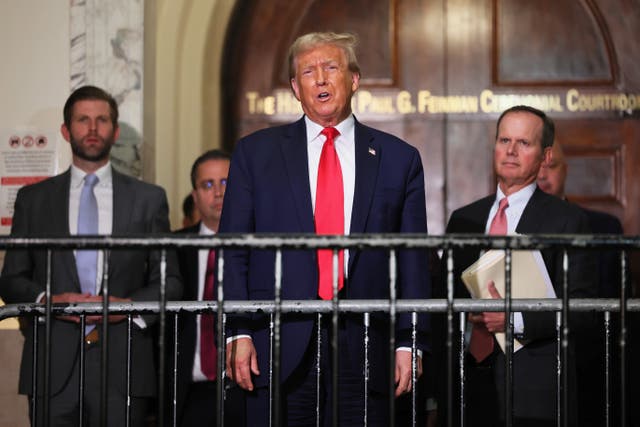 <p>Donald Trump and his legal team, along with his son Eric Trump, left, address reporters during a lunch break in a civil trial on fraud allegations in Manhattan on 17 October. </p>