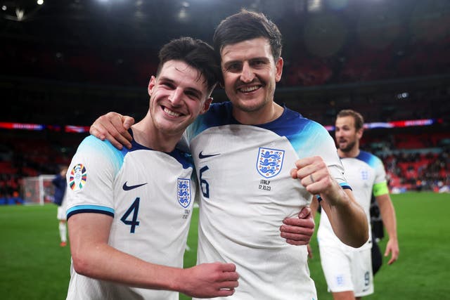 <p>Declan Rice, left, and Harry Maguire celebrate England’s 3-1 win over Italy, which sealed qualification for Euro 2024 in Germany </p>