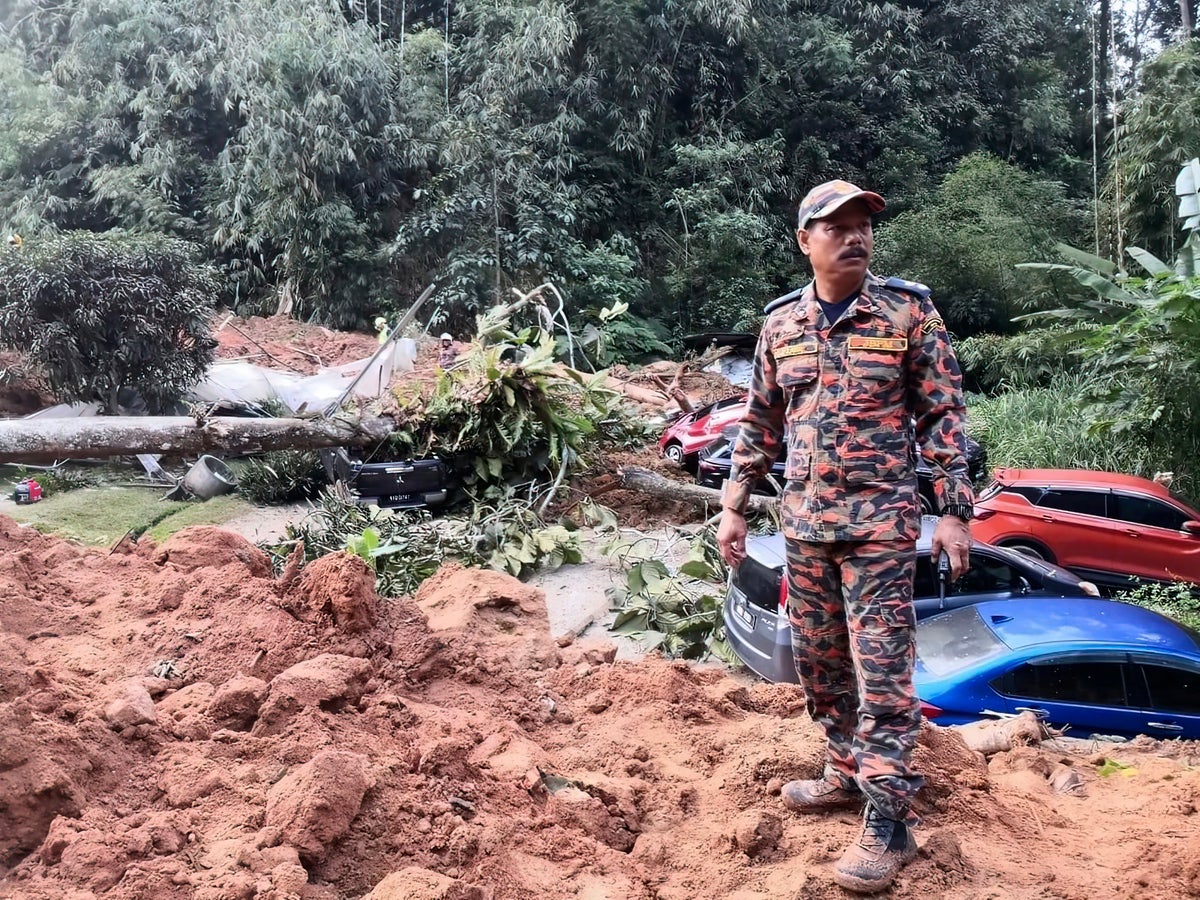 Malaysia says landslide that killed 31 people last year was caused by heavy rain, not human activity