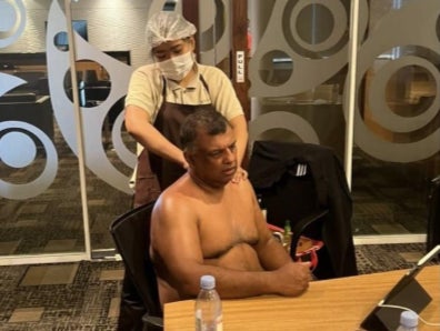AirAsia boss Tony Fernandes sparked outrage after posting a half-naked photo of himself while getting a massage during a Zoom meeting