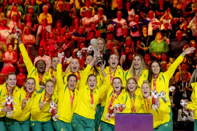 Australia celebrate with the trophy after the 2023 Netball World Cup final in Cape Town (PA)