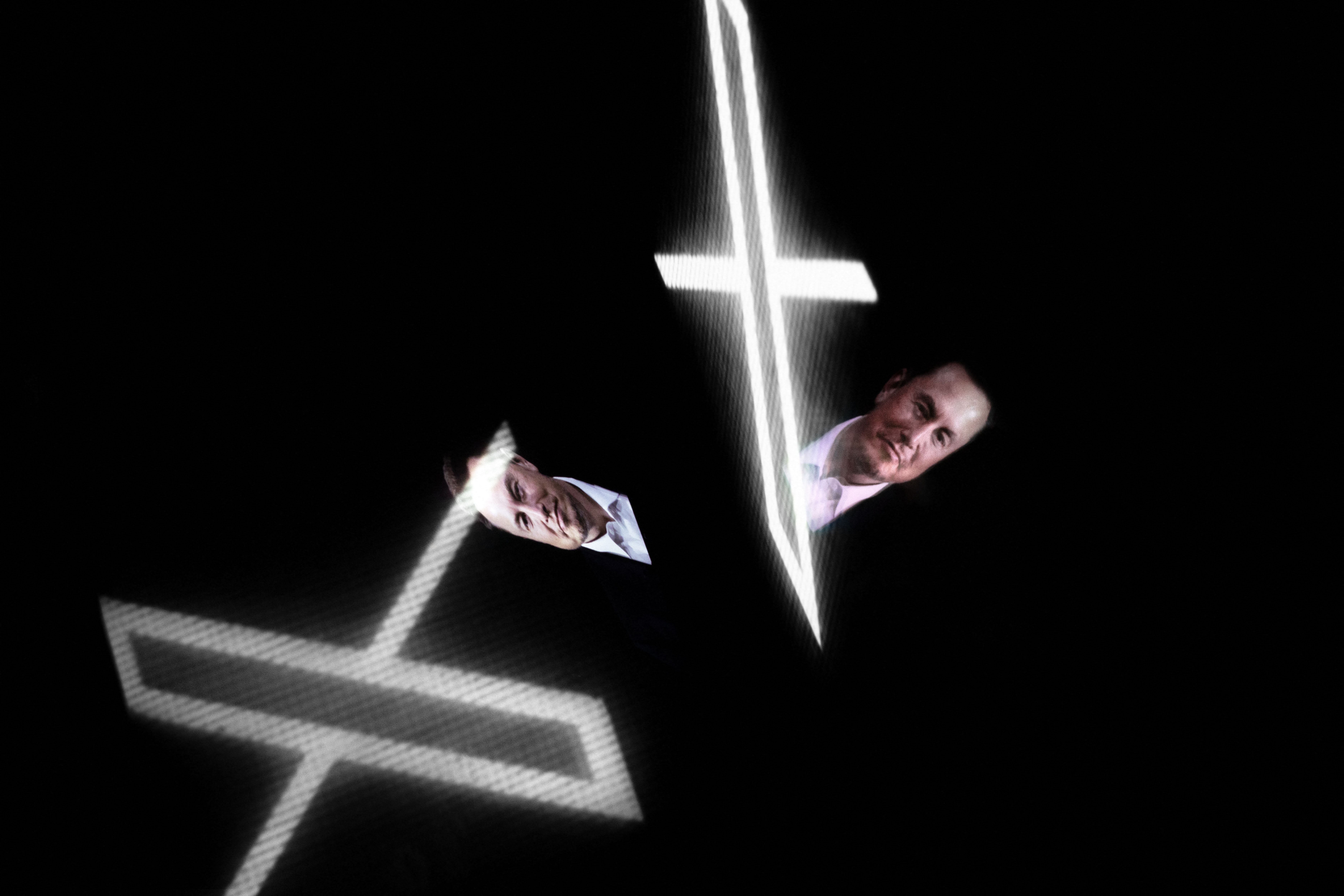 <p>This picture shows the new Twitter logo rebranded as X, reflected in smartphone screens, in Paris on July 24, 2023</p>