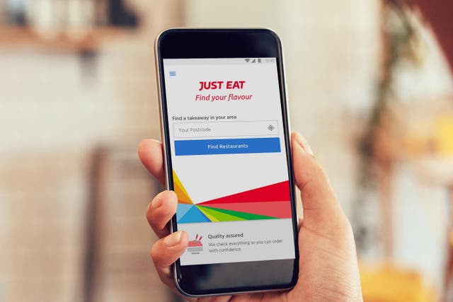 Online food delivery giant Just Eat Takeaway.com has increased its earnings outlook once again after returning to sales growth across the UK and Ireland (Just Eat/PA)