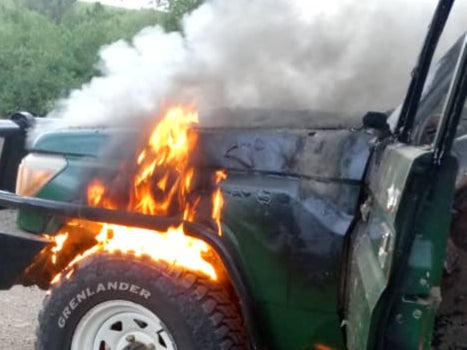 <p>The four-wheel-drive vehicle the trio was travelling in was found still on fire in the national park, with flames and plumes of smoke seen billowing off its bonnet in a picture Uganda’s police posted on its X account</p>