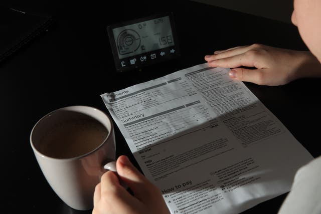 A smart meter next to an energy bill.