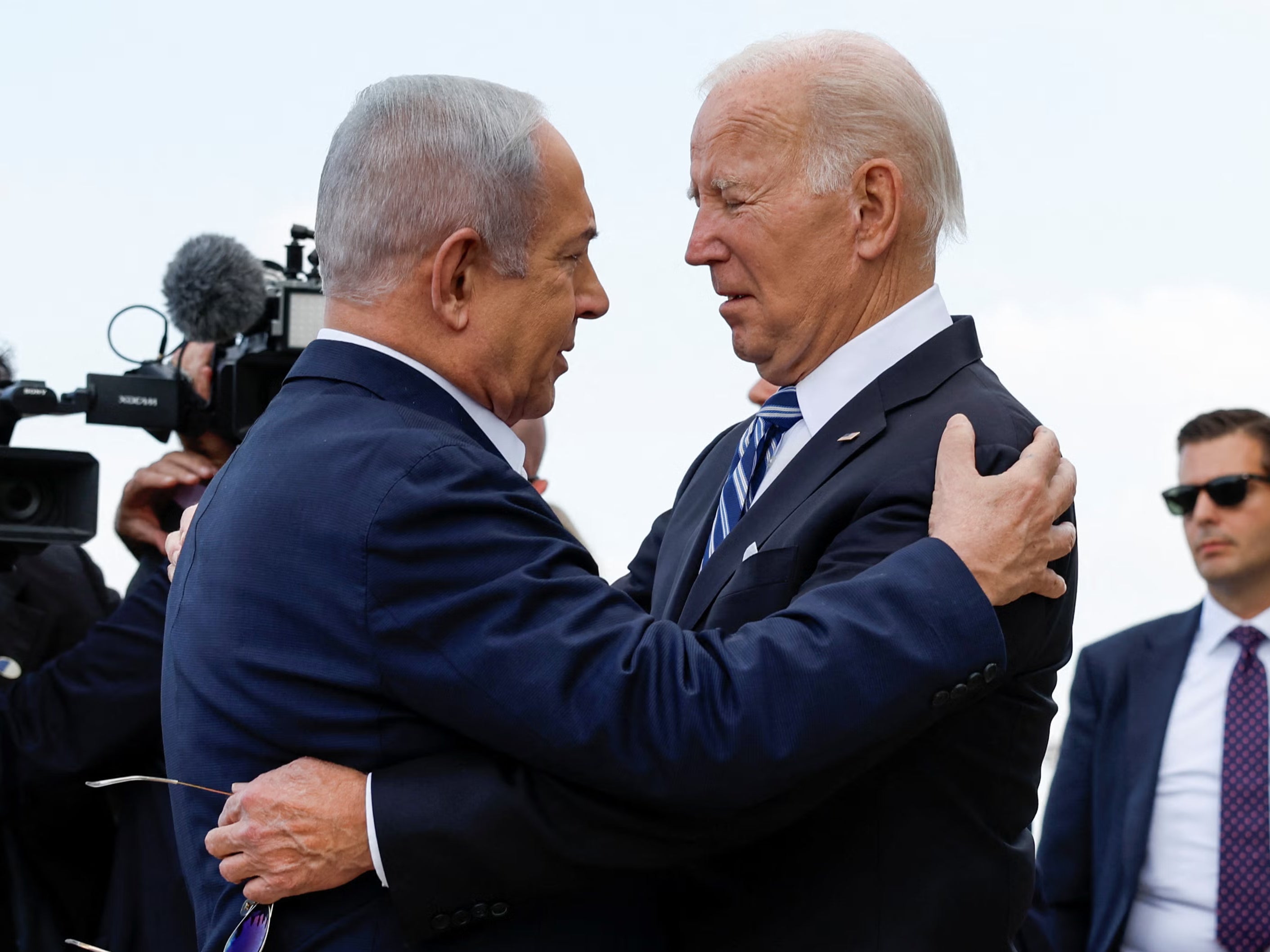 Biden and Netanyahu hug on tarmac in Tel Aviv