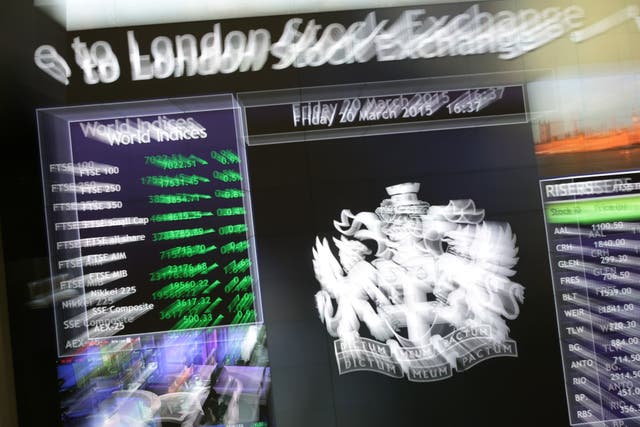 An information screen displaying the FTSE 100, which has risen above 7,000 mark for the first time and hit a new record high, at the London Stock Exchange in Paternoster Square, London (Yui Mok/PA)