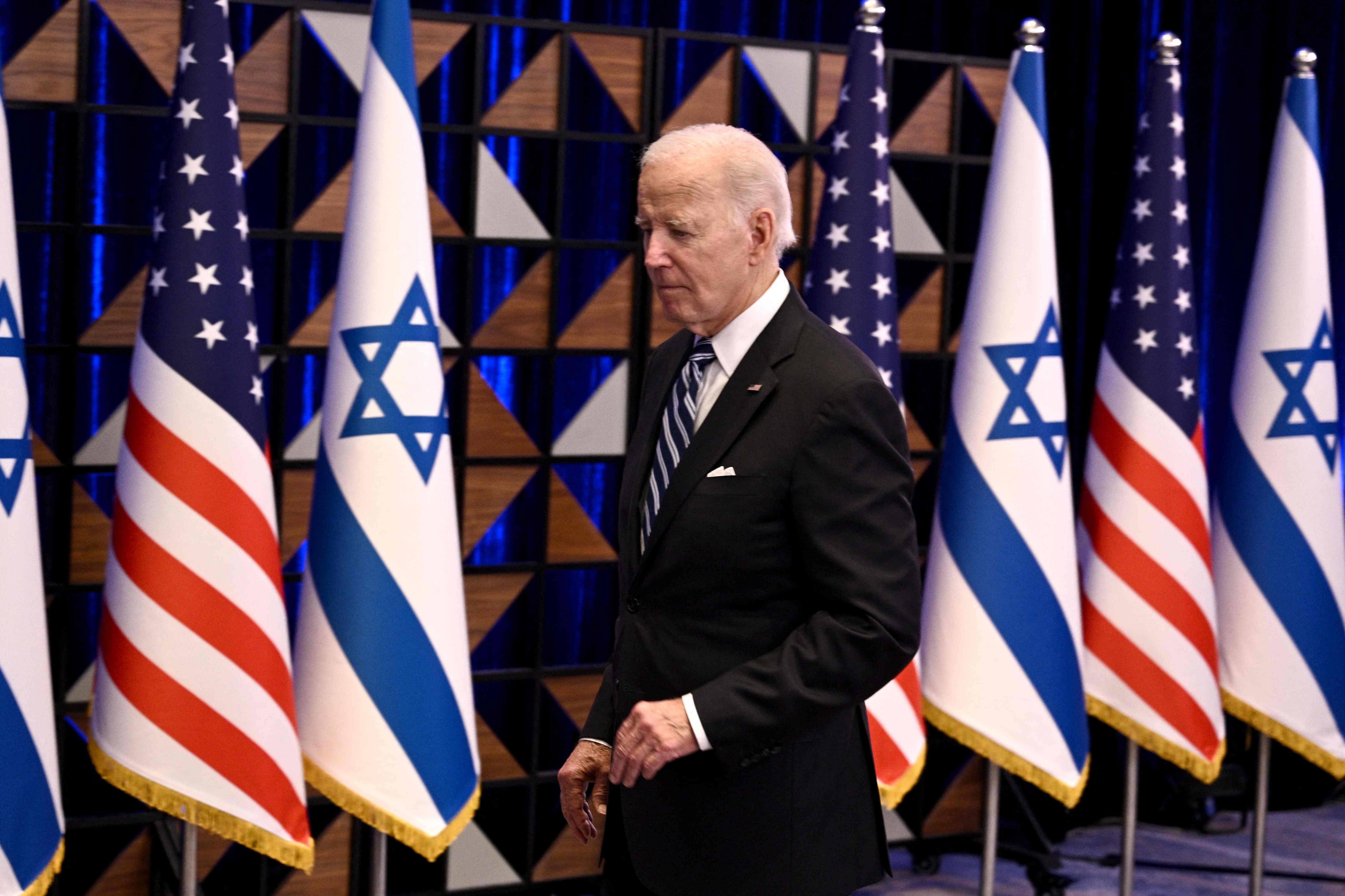 US President Joe Biden leaves the room at the end of a press conference following a solidarity visit to Israel, on October 18, 2023, in Tel Aviv