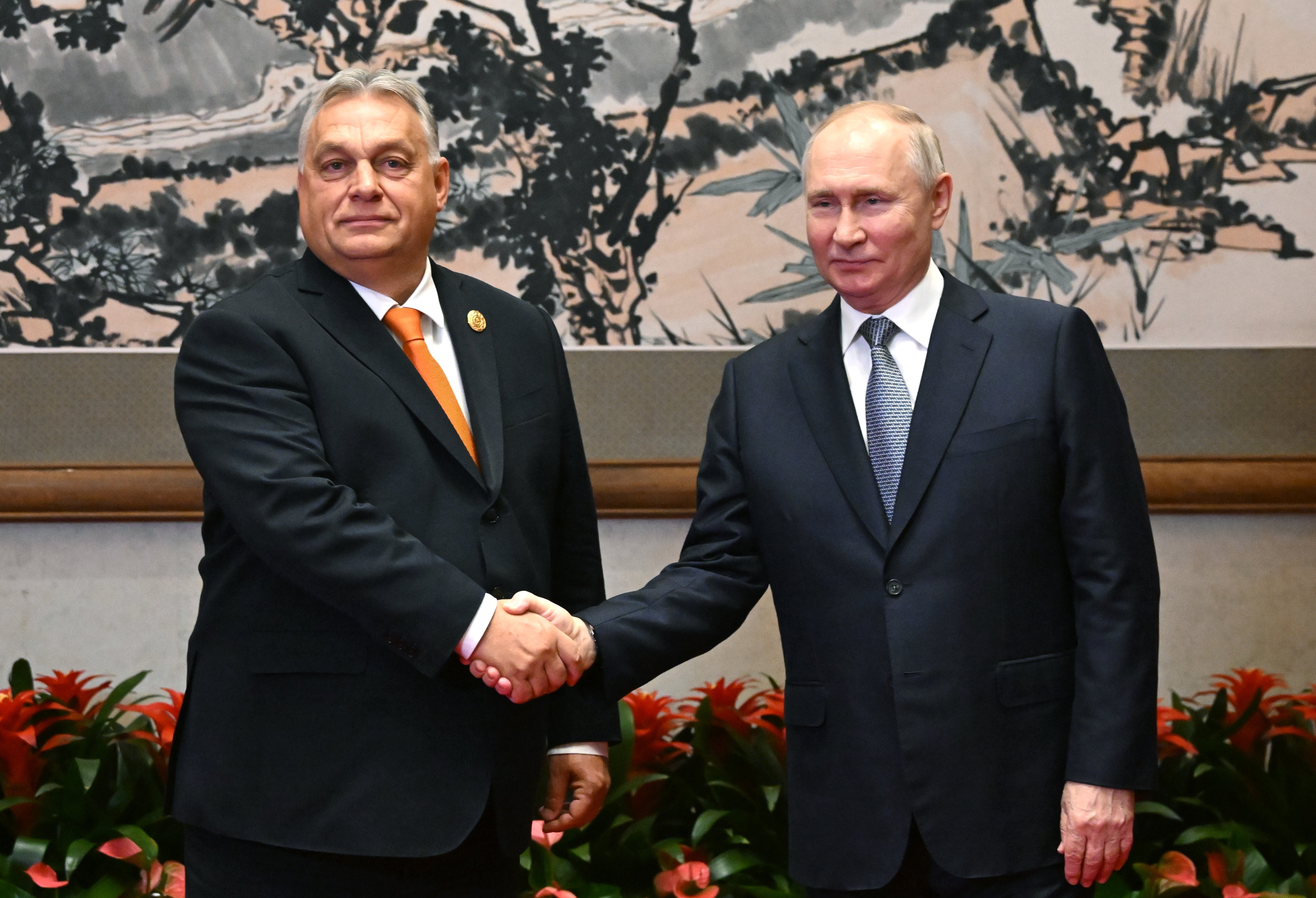 Hungary’s prime minister Viktor Orban shakes hands with Putin in Beijing, in defiance of EU opposition to Russia over the invasion of Ukraine