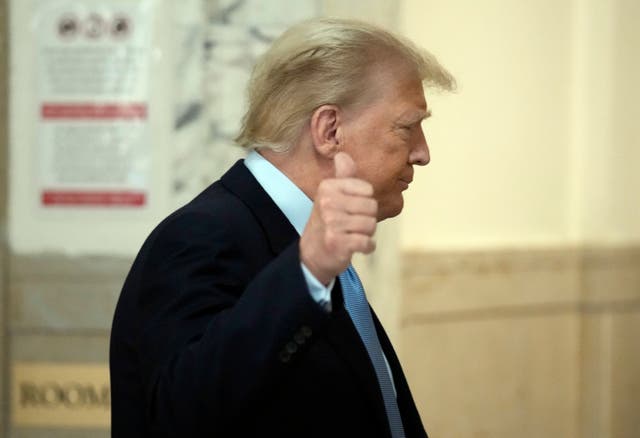 <p>Donald Trump gives a thumbs-up to cameras at his criminal fraud trial in Manhattan </p>