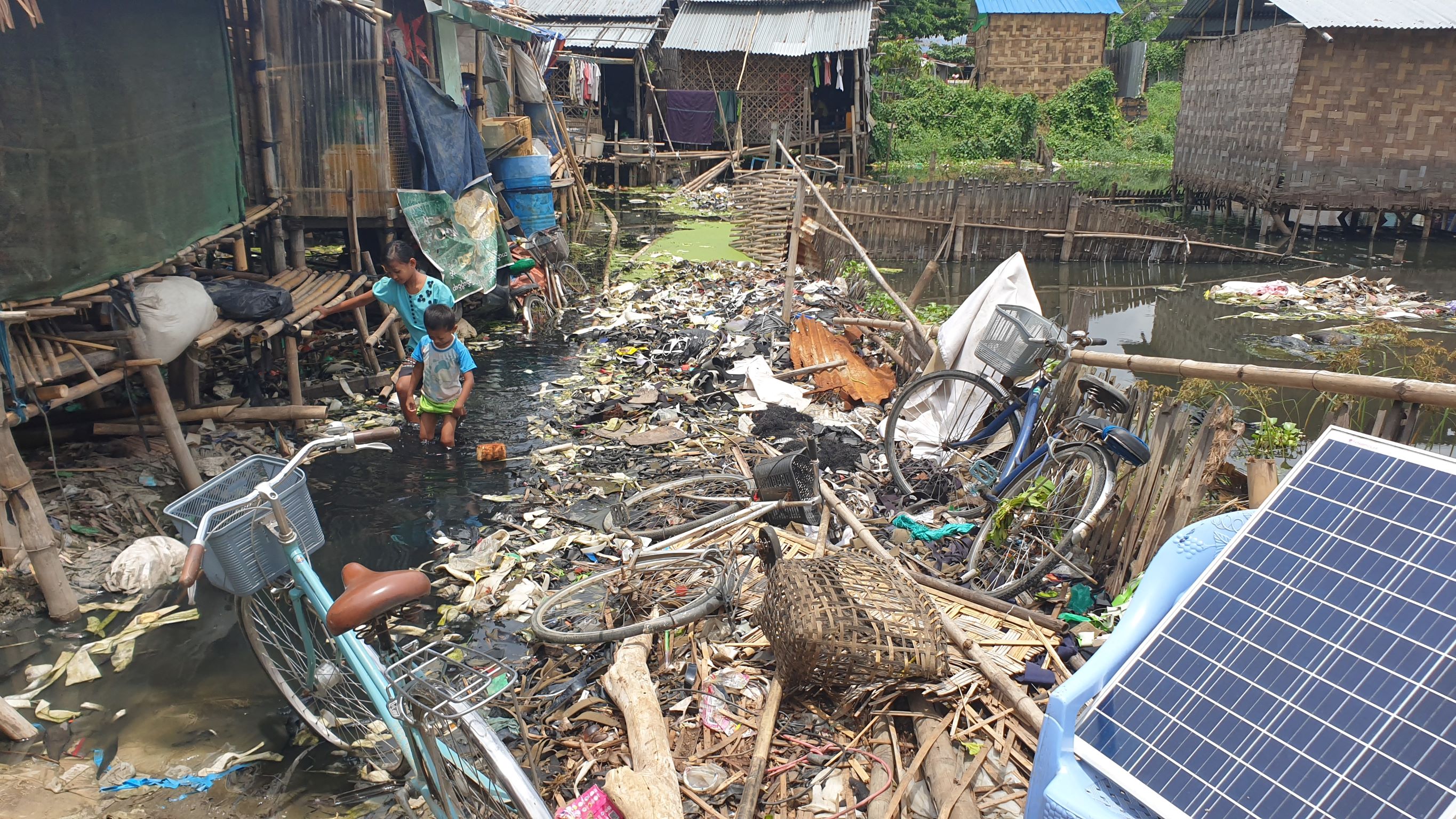 Foreign plastic waste is dumped throughout Ward 27, an informal community in Yangon township, where residents are fearful of speaking out due to repercussions from Myanmar’s military junta