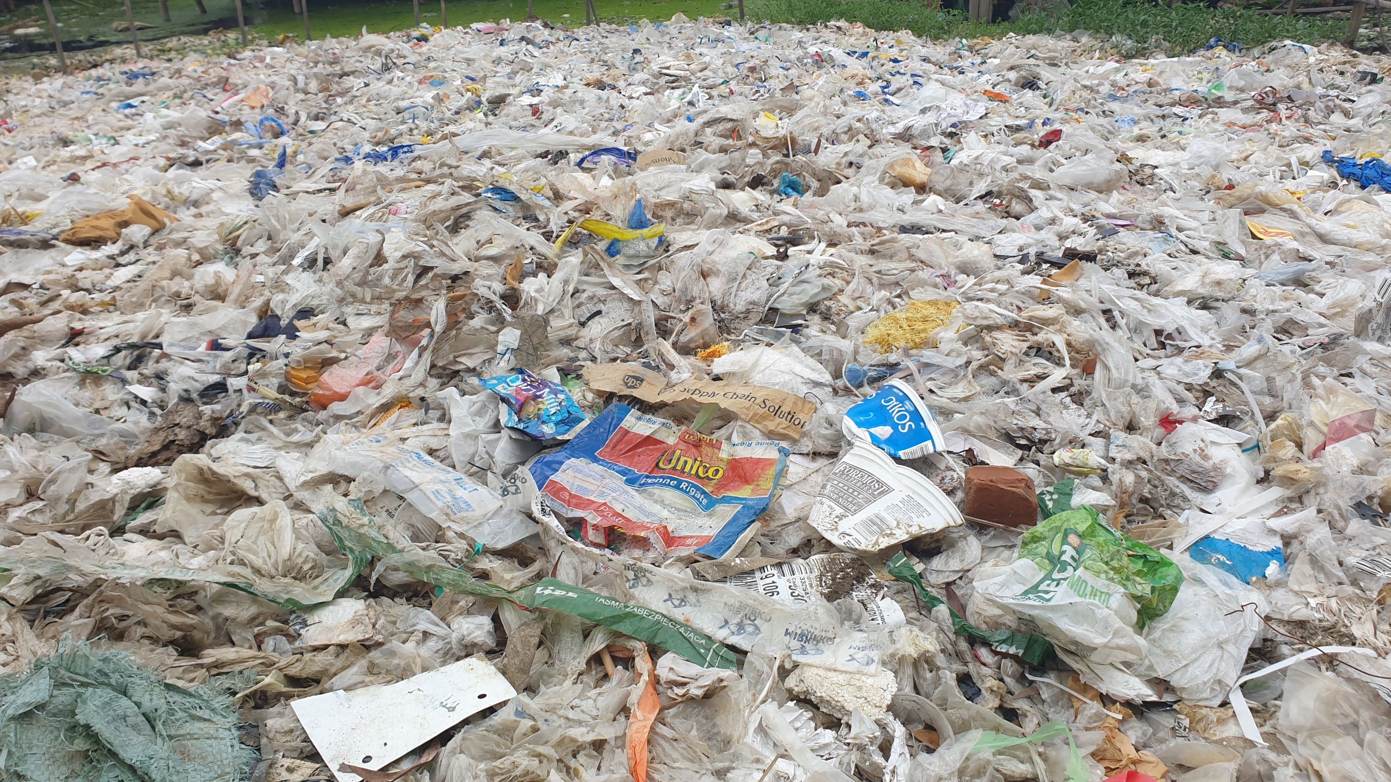 Mound of plastic waste in Ward 27 of Shwe Pyi Thar township in Yangon. Plastic packaging from foreign brands, not sold in Myanmar, is visible