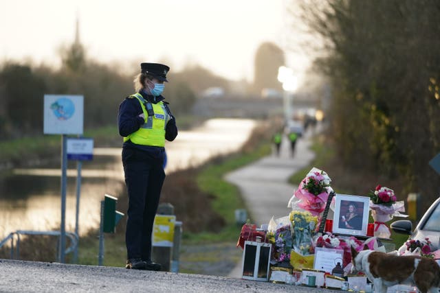Floral tributes laid at the Grand Canal in Tullamore, Co Offaly, where primary school teacher Ashling Murphy was found dead after going for a (Brian Lawless/PA)