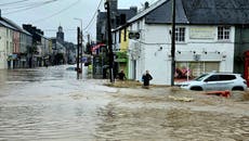 Storm Babet in pictures as town evacuated and roads collapse during red warning downpours