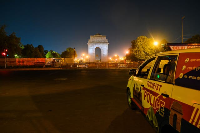 <p>File Police keep vigil at an empty street in New Delhi in 2021 as the Indian capital </p>