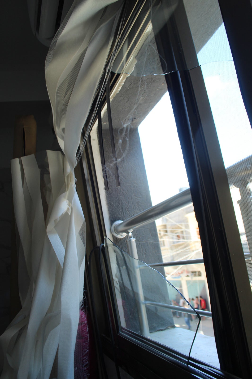 Broken windows due to the effects of Israeli shelling at the Jabaliyya Hospital