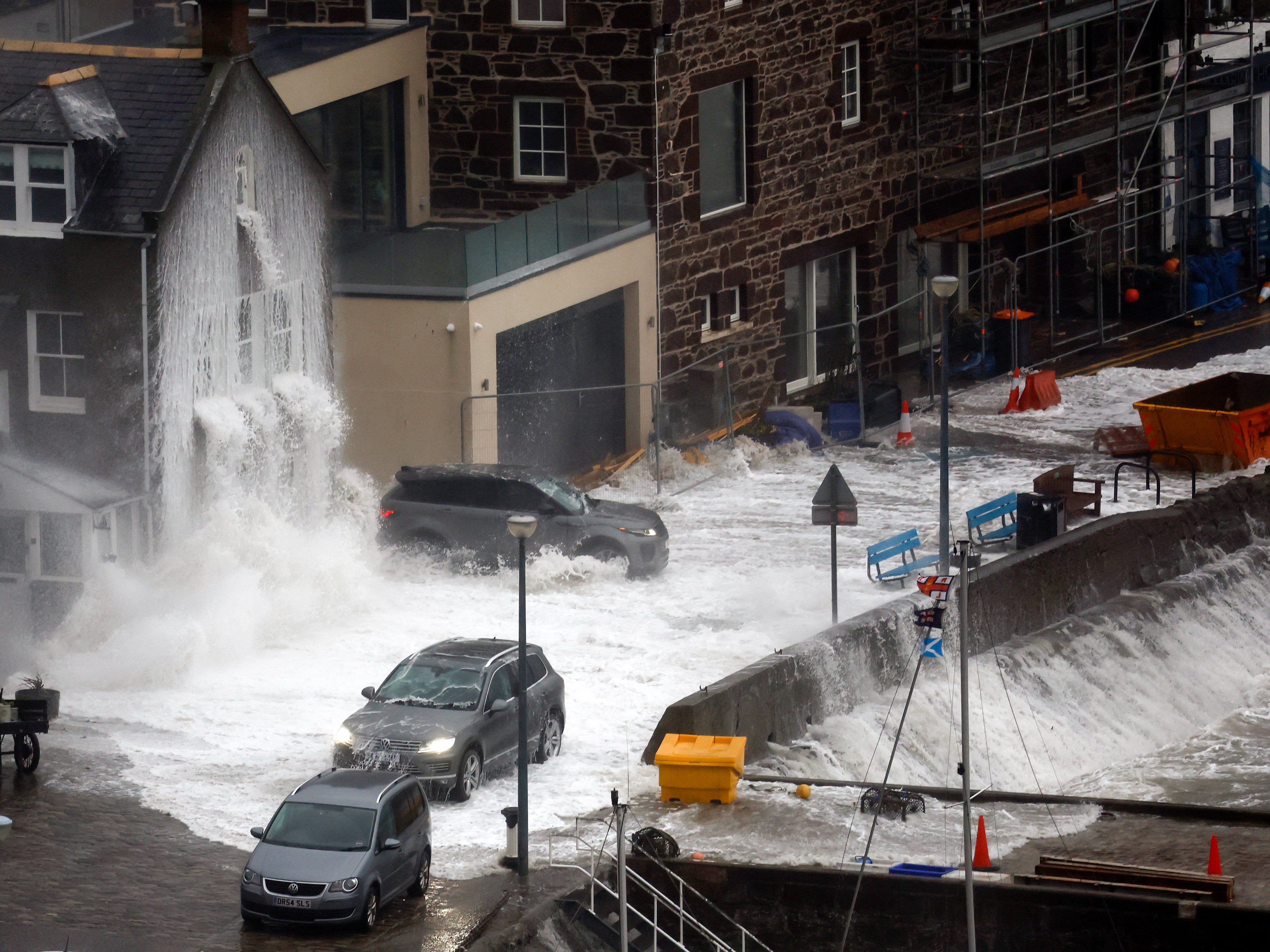 Waves crash over the harbour in Stonehaven