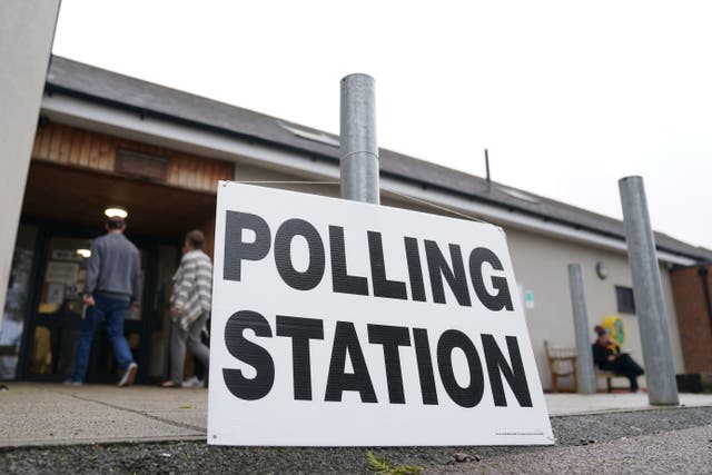 People at Shefford Town Memorial Association to cast their vote in the Mid Bedfordshire by-election (PA)