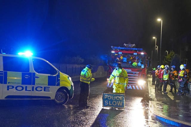 Police close River Street in Brechin as members of the fire service ask residents to evacuate due to flood warnings (Andrew Milligan/PA)