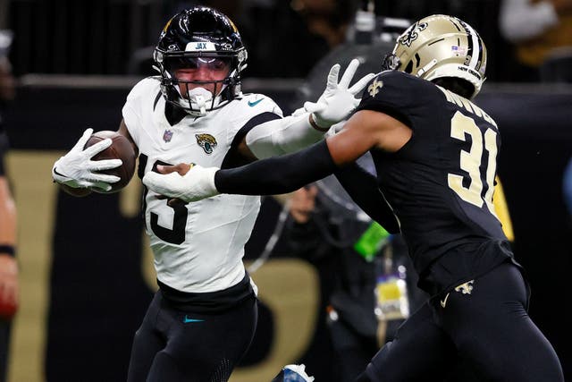 Jacksonville Jaguars wide receiver Christian Kirk, left, runs past New Orleans Saints safety Jordan Howden (31) for a 44-yard touchdown (Butch Dill/AP)