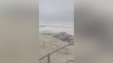 Sea foam blankets beach in Scotland as Storm Babet brings powerful winds