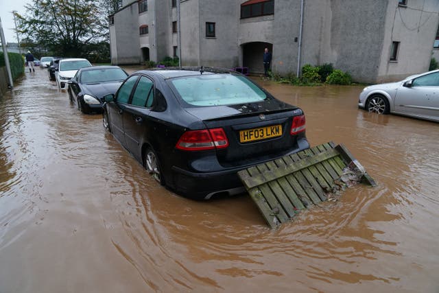 Large parts of the UK have been hit by transport disruption due to heavy rain and strong winds from Storm Babet (Andrew Milligan/PA)