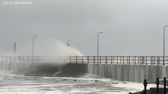 <p>Storm Babet batters Britain as rivers burst, rail lines flood and lighthouse dome gets swept away</p>