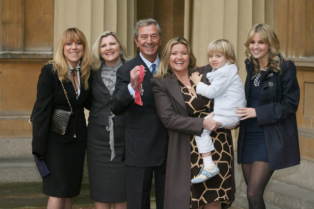 <p>Kristina O’Connor (far right) with (from left) her half-sisters Samantha and Karen, father Des, stepmother Jodie, and half-brother Adam, after the entertainer received his CBE at Buckingham Palace in 2008 </p>