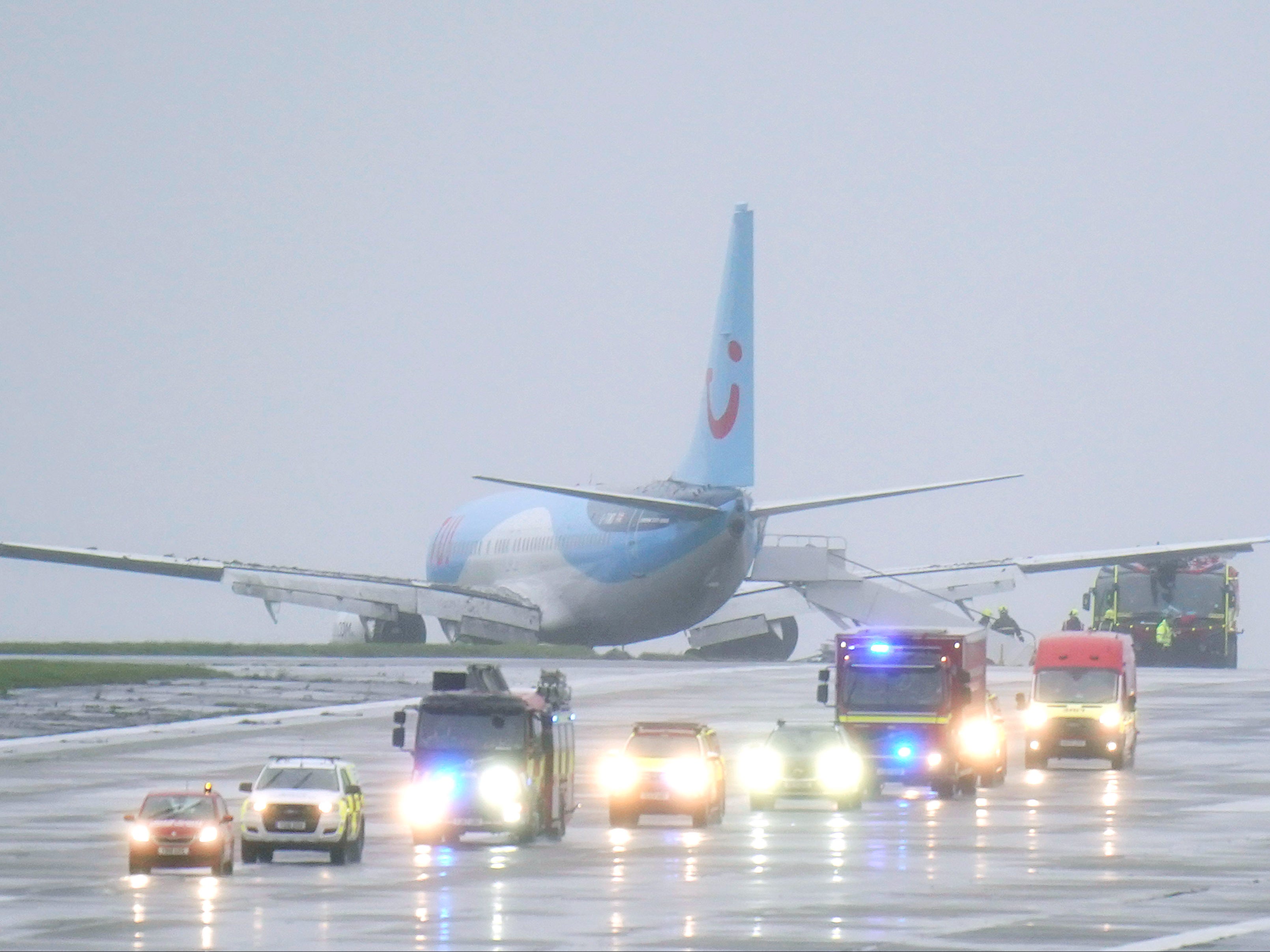 Emergency services at the scene after a passenger plane came off the runway at Leeds Bradford Airport while landing in windy conditions during Storm Babet