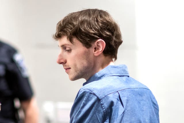 <p>Logan Clegg talks with his defense attorney at his trial on 3 October </p>