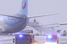 Third person dies and plane skids off runway as Storm Babet batters UK